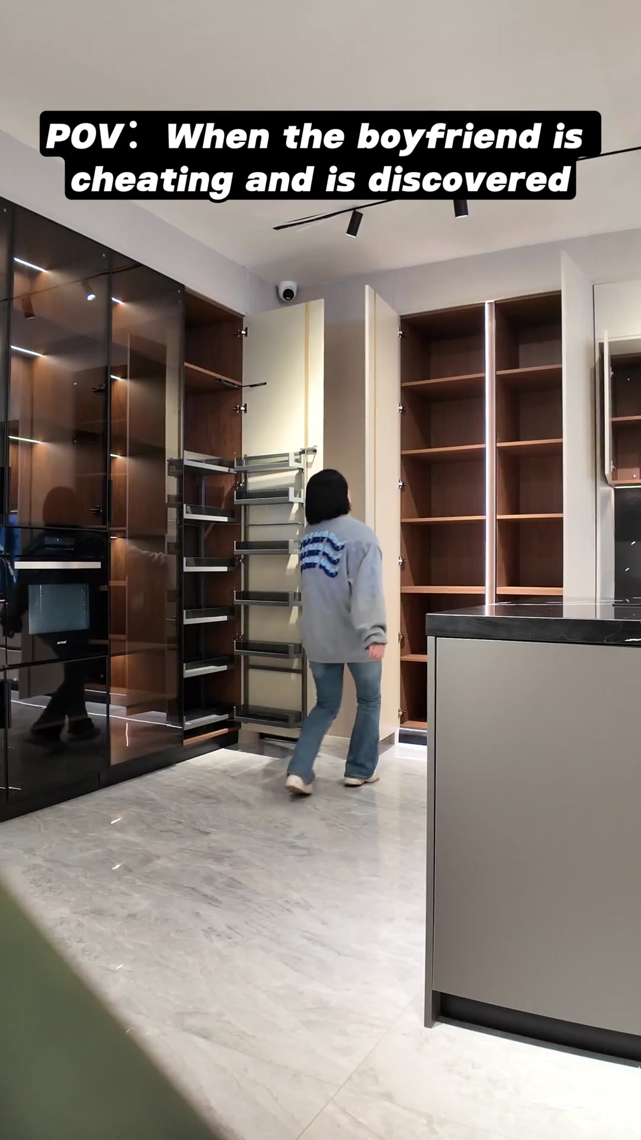 Modern kitchen cabinets with island and stove in showroom