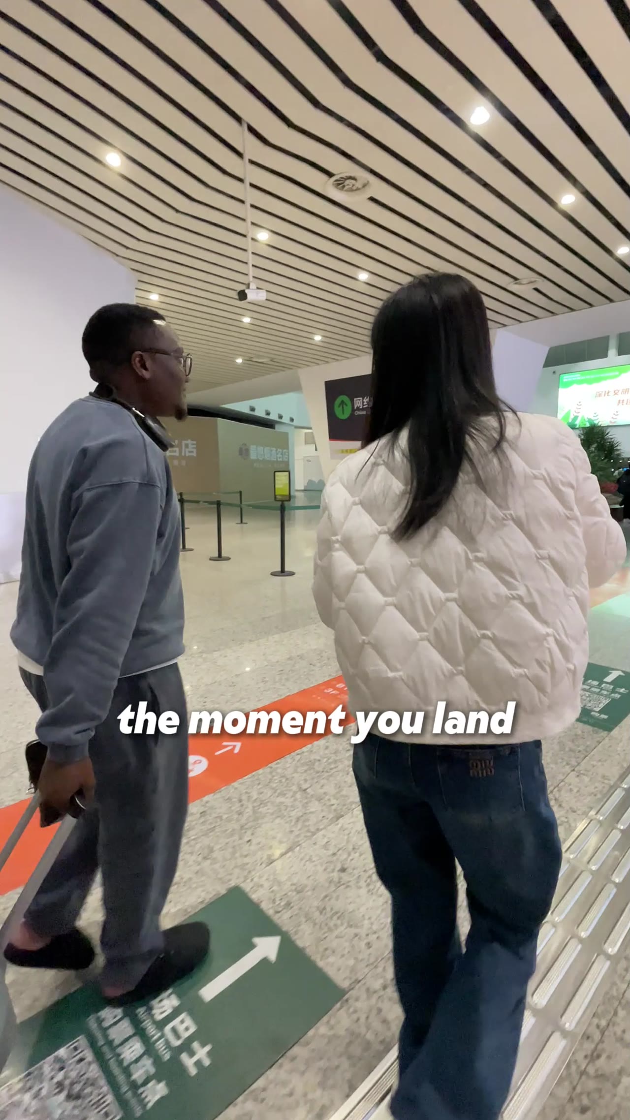 Woman presents interior design showroom from the moment you land