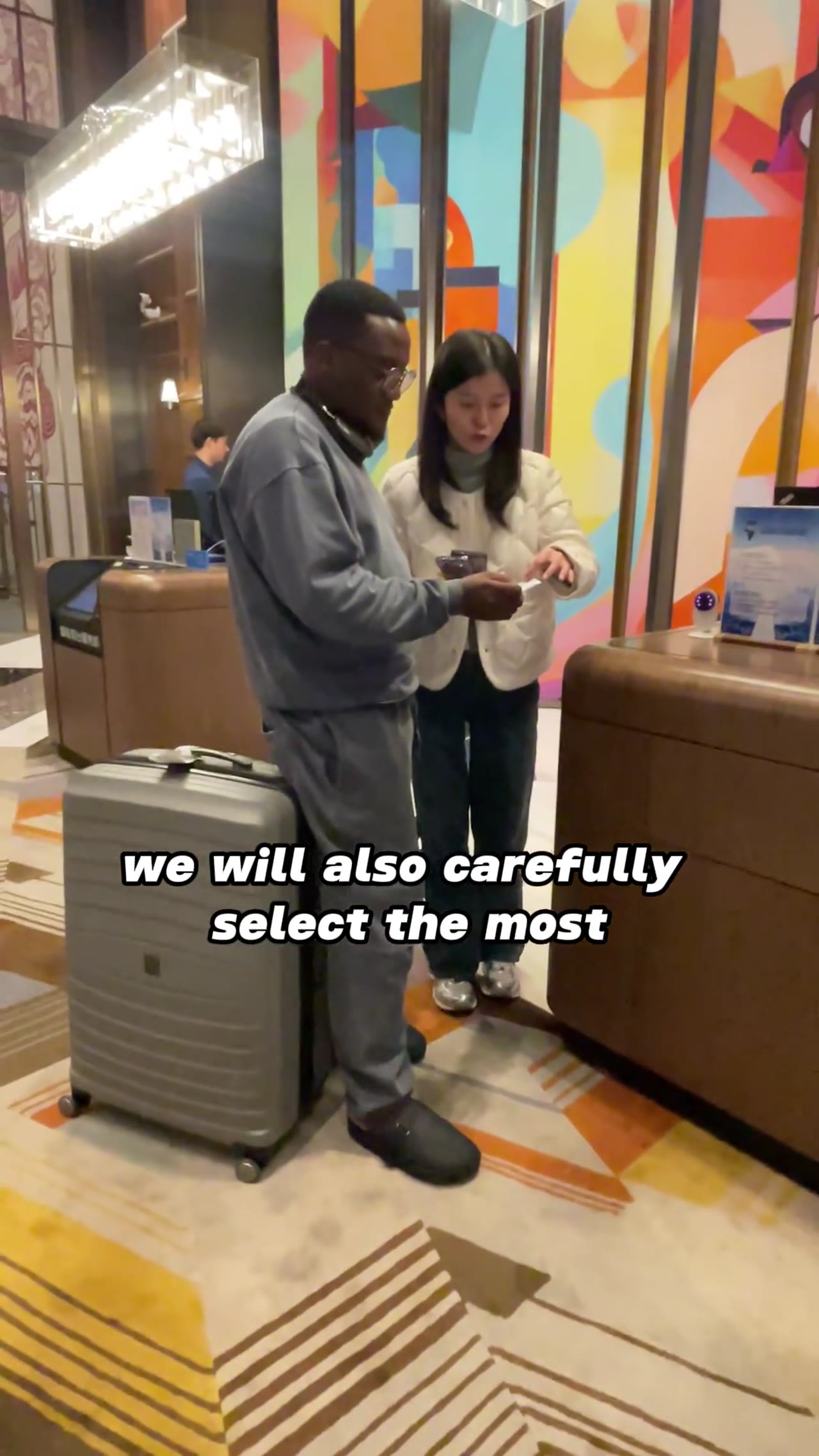 Woman presents modern furniture in a George Group showroom