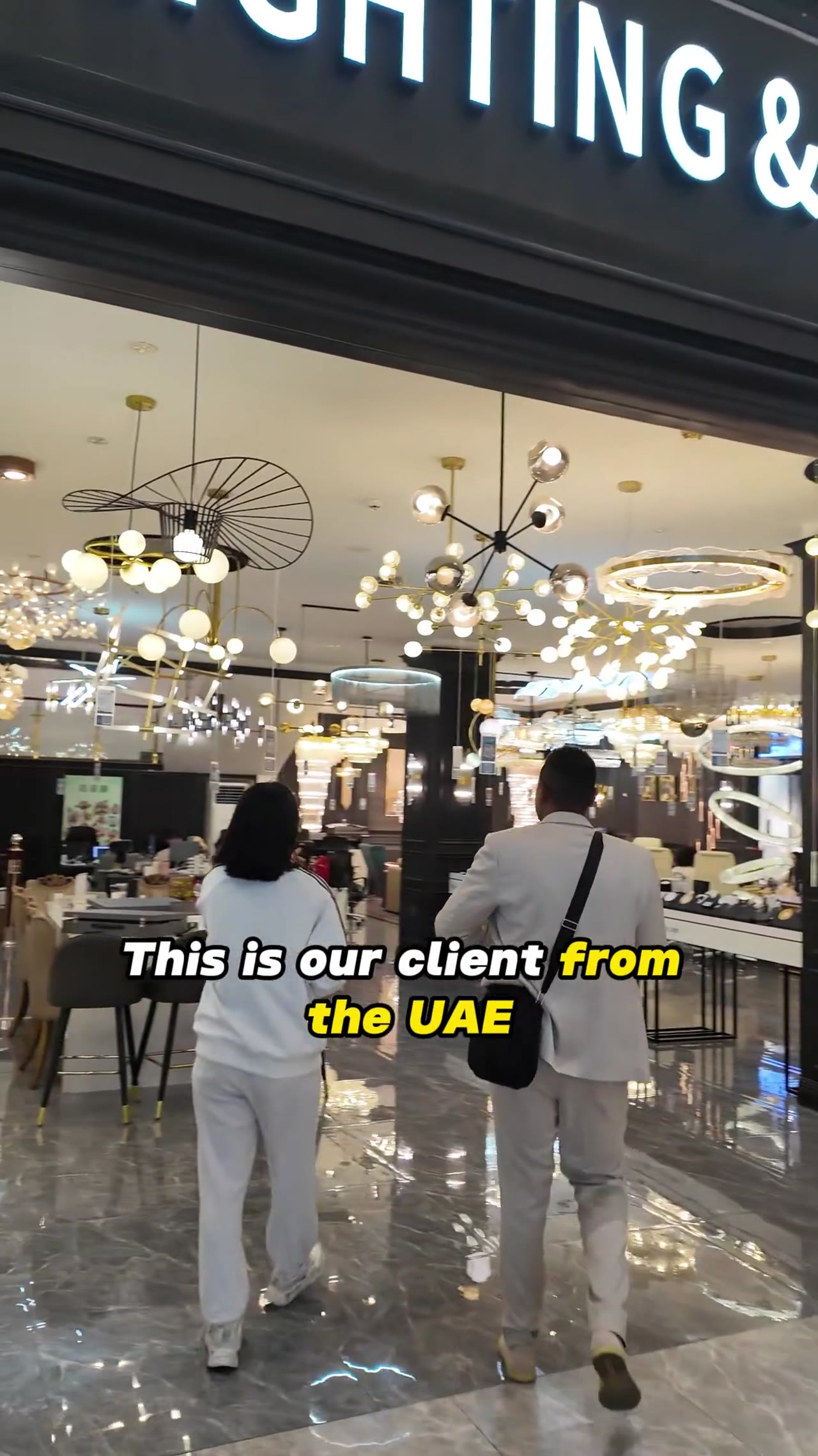 Woman presents windows and doors in a George Group showroom