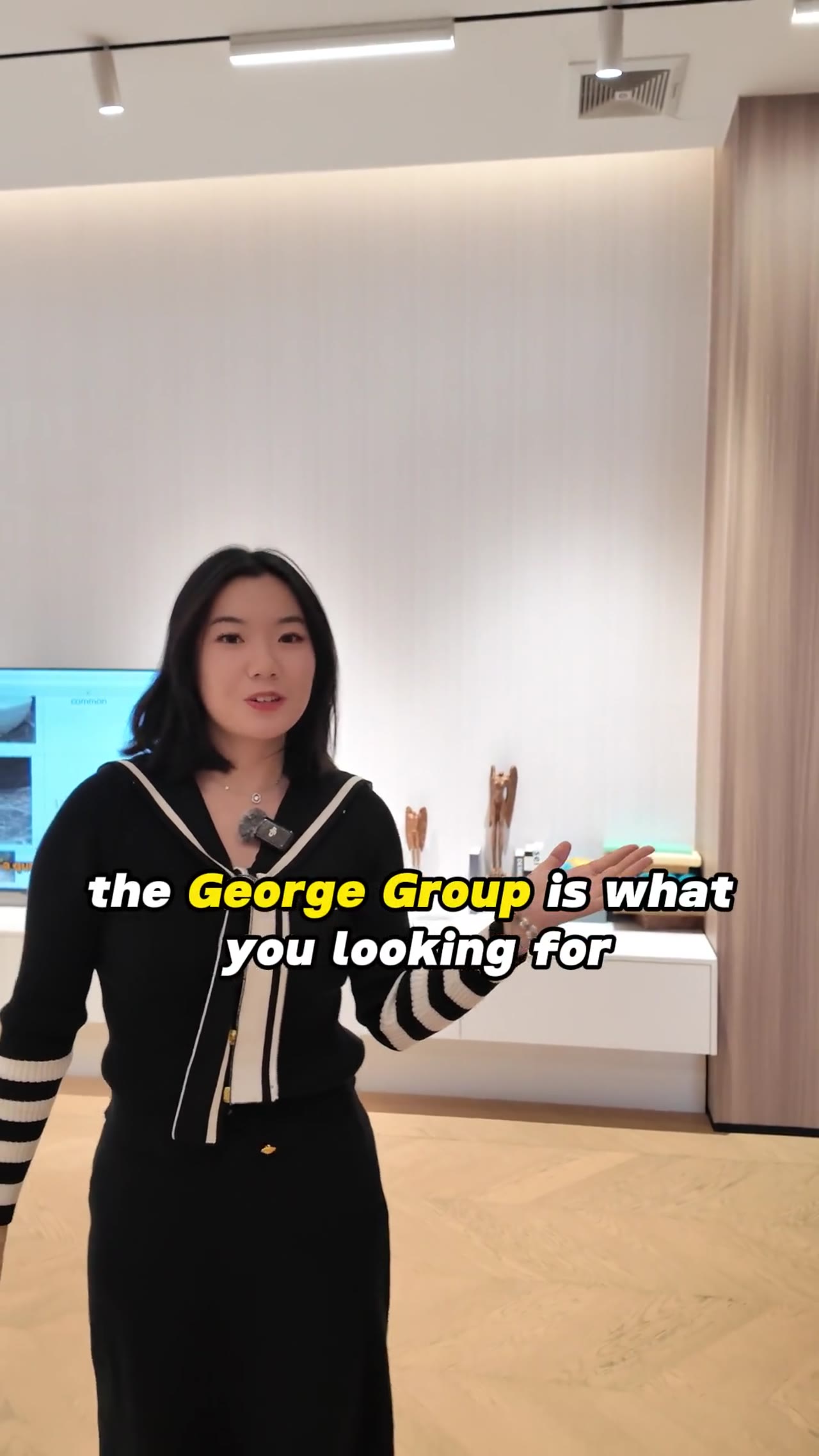 Woman presents sanitary ware in a George Group showroom
