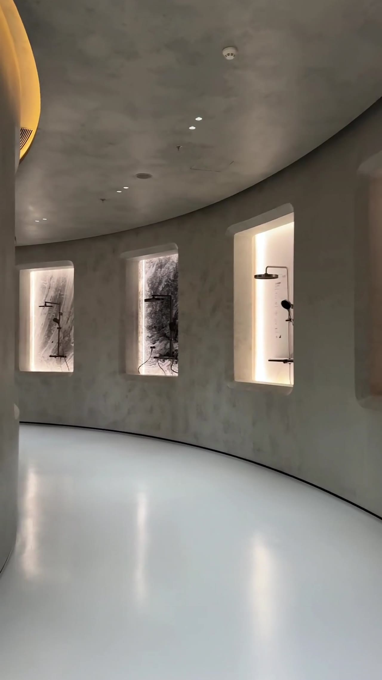Woman presents interior design in a George Group showroom